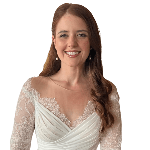 Real bride styled by Tuscany Bridal Beauty Stylists, wearing a lace wedding dress and smiling before her ceremony.